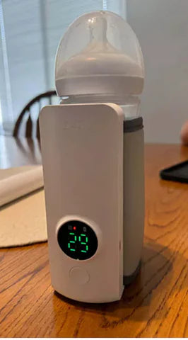 Bottle warmer with digital display on a wooden surface